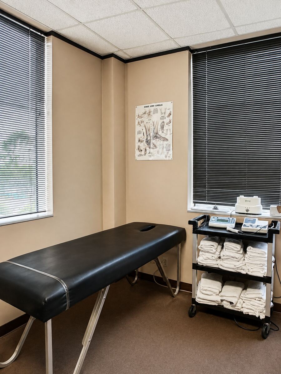 Exam room with treatment table and windows