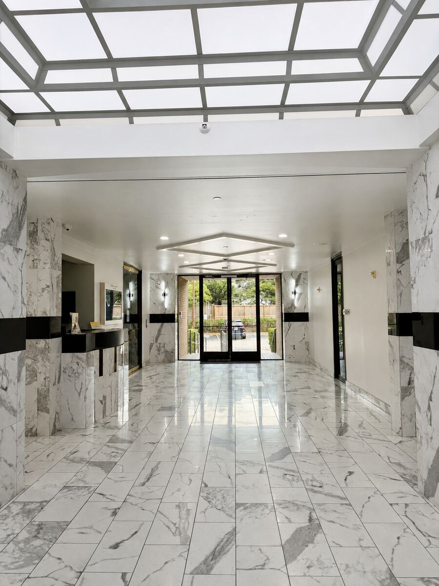 Ground-floor lobby and glass entrance of the building at 2525 N Loop W Fwy, Houston